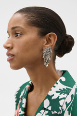 Profile view of model wearing the Oroton Elin Earrings in Clear and Brass base for Women .