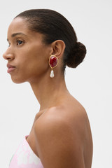 Profile view of model wearing the Oroton Cove Earrings in Lava/Worn Gold and Brass base for Women .