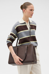 Profile view of model wearing the Oroton Anika 13" Day Bag in Coffee Bean and  for Women .