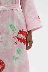 Profile view of model wearing the Oroton Cabana Floral Long Tunic Dress in Rose and 100% heavy linen fabric for Women .