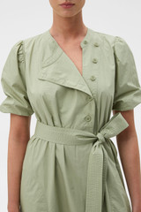 Profile view of model wearing the Oroton Isla Detail Dress in Soft Sage and 100% cotton poplin fabric for Women .