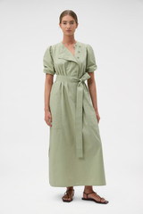 Profile view of model wearing the Oroton Isla Detail Dress in Soft Sage and 100% cotton poplin fabric for Women .