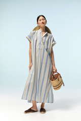 Profile view of model wearing the Oroton Vintage Stripe Dress in Flag Blue and 100% cotton fabric for Women .