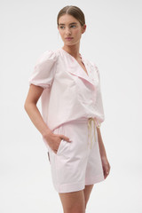 Profile view of model wearing the Oroton Weekend Short in Palest Pink and 100% cotton fabric for Women .