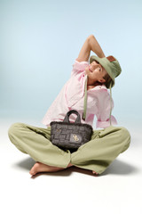 Profile view of model wearing the Oroton Snap Detail Tunic in Palest Pink and 100% cotton twill fabric for Women .