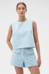 Profile view of model wearing the Oroton Seabird Short in Seaside Blue and 50% cotton and 50% linen blend fabric for Women .