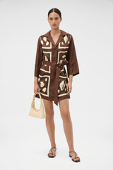 Profile view of model wearing the Oroton Graphic Shell Tunic Dress in Dark Chocolate and 100% silk twill fabric for Women .
