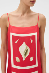 Profile view of model wearing the Oroton Graphic Shell Dress in Ribbon Red and 100% silk twill fabric for Women .