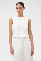 Profile view of model wearing the Oroton Tassel Lace Top in White and 45% viscose, 30% rayon, and 25% linen blend fabric for Women .