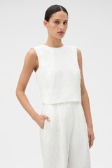 Profile view of model wearing the Oroton Tassel Lace Top in White and 45% viscose, 30% rayon, and 25% linen blend fabric for Women .