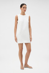 Profile view of model wearing the Oroton Tassel Lace Shift Dress in White and 45% viscose, 30% rayon, and 25% linen blend fabric for Women .