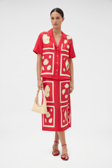 Profile view of model wearing the Oroton Graphic Shell Slip Skirt in Ribbon Red and 100% silk twill fabric for Women .