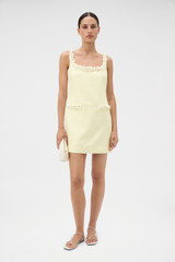 Profile view of model wearing the Oroton Embellished Shift Dress in Lemon and 100% heavy weight linen fabric for Women .