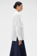Profile view of model wearing the Oroton Stitch Detail Shirt in White and 100% linen fabric for Women .