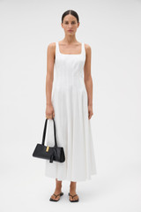 Profile view of model wearing the Oroton Panelled Day Dress in White and 98% cotton and 2% spandex blend fabric for Women .