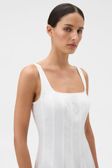 Profile view of model wearing the Oroton Panelled Day Dress in White and 98% cotton and 2% spandex blend fabric for Women .