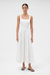 Profile view of model wearing the Oroton Panelled Day Dress in White and 98% cotton and 2% spandex blend fabric for Women .