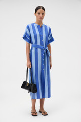 Profile view of model wearing the Oroton Slub Silk Stripe Column Dress in Azure Blue and 100% silk fabric for Women .
