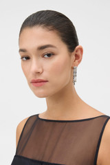 Profile view of model wearing the Oroton Chloe Earrings in Silver and Rhodium-plated brass for Women .