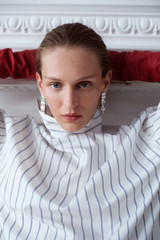 Profile view of model wearing the Oroton Chloe Earrings in Silver and Rhodium-plated brass for Women .