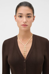 Profile view of model wearing the Oroton Chloe Necklace in Worn Gold and 14k yellow gold-plated brass with Oroton’s signature soft-burnished finish for Women .
