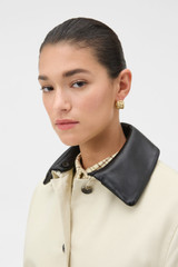 Profile view of model wearing the Oroton Wicker Hoops in Gold and 14k yellow gold-plated brass for Women .
