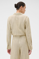Profile view of model wearing the Oroton Check Crop Shirt in Pale Lemon/Chocolate and 87% viscose and 13% polyester blend fabric for Women .