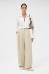 Profile view of model wearing the Oroton Half Placket Zip Shirt in Milk and 77% Viscose, 23% polyamide for Women .