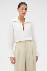 Profile view of model wearing the Oroton Half Placket Zip Shirt in Milk and 77% Viscose, 23% polyamide for Women .