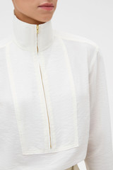 Profile view of model wearing the Oroton Half Placket Zip Shirt in Milk and 77% Viscose, 23% polyamide for Women .