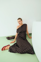Profile view of model wearing the Oroton Graphic Spot Dress in Dark Chocolate and 100% Silk for Women .