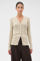 Profile view of model wearing the Oroton Ribbed Cardigan in Almond Creme and 100% Cotton for Women .