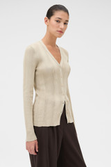 Profile view of model wearing the Oroton Ribbed Cardigan in Almond Creme and 100% Cotton for Women .