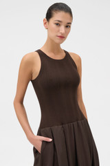 Profile view of model wearing the Oroton Knit Bodice Midi Dress in Dark Chocolate and Knit: 100% cotton; Skirt: 77% viscose, 23% polyester for Women .
