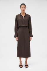 Profile view of model wearing the Oroton Midi Skirt in Dark Chocolate and 77% viscose and 23% polyamide blend fabric for Women .