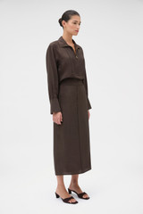 Profile view of model wearing the Oroton Midi Skirt in Dark Chocolate and 77% viscose and 23% polyamide blend fabric for Women .