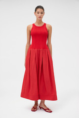 Profile view of model wearing the Oroton Knit Bodice Midi Dress in Ribbon Red and Knit: 100% cotton; Skirt: 77% viscose, 23% polyester for Women .