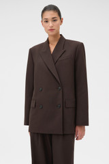 Profile view of model wearing the Oroton Double Breasted Blazer in Dark Chocolate and 95% Wool, 5% lycra for Women .