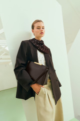 Profile view of model wearing the Oroton Double Breasted Blazer in Dark Chocolate and 95% Wool, 5% lycra for Women .