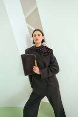 Profile view of model wearing the Oroton Miriam Crackle Day Bag in Dark Chocolate and Premium smooth leather for Women .