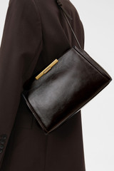 Profile view of model wearing the Oroton Miriam Crackle Day Bag in Dark Chocolate and Premium smooth leather for Women .