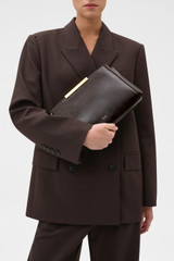 Profile view of model wearing the Oroton Miriam Crackle Day Bag in Dark Chocolate and Premium smooth leather for Women .