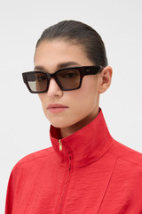 Profile view of model wearing the Oroton Stevie Sunglasses in Cherry Haze and Acetate material for Women . IP:2