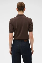 Profile view of model wearing the Oroton Short Sleeve Knit Polo in Bitter Chocolate and 100% Pima cotton yarn fabric for Women .