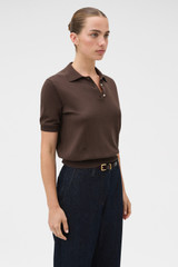 Profile view of model wearing the Oroton Short Sleeve Knit Polo in Bitter Chocolate and 100% Pima cotton yarn fabric for Women .