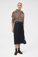 Profile view of model wearing the Oroton Stripe Market Tee in Dark Chocolate and 100% cotton fabric for Women .