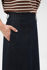 Profile view of model wearing the Oroton Denim Midi Skirt in Dark Denim and 100% cotton fabric for Women .