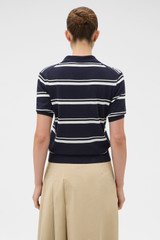 Profile view of model wearing the Oroton Short Sleeve Stripe Knit Polo in North Sea and 100% Pima cotton yarn fabric for Women .