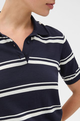 Profile view of model wearing the Oroton Short Sleeve Stripe Knit Polo in North Sea and 100% Pima cotton yarn fabric for Women .