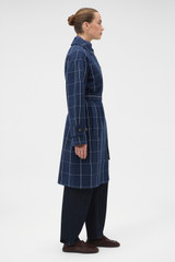 Profile view of model wearing the Oroton Sunday Check Mac in North Sea and 100% cotton fabric for Women .